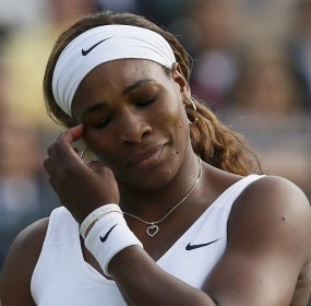 Serena Williams of the U.S. reacts during her women's singles tennis match against Alize Cornet of France at the Wimbledon Tennis Championships, in London