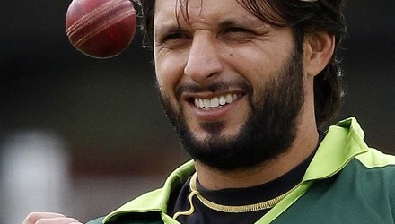 Pakistan's captain Shahid Afridi catches a ball during a training session before their first cricket test match against Australia at Lord's cricket ground in London